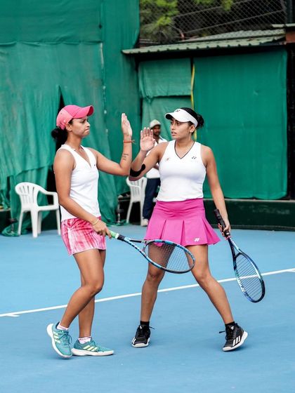 A high-five between points. We foster a supportive environment where players lift each other up, even in the heat of competition.