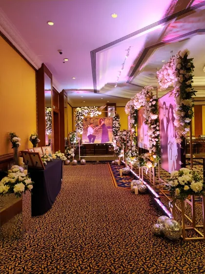 A full view of the personalized photo gallery walkway. This immersive entrance allows guests to feel connected to the couple's story as they make their way into the reception.
