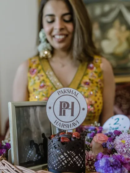 A personalized cake topper and a framed photo are among the little things that pack the most meaning. We believe in weaving these thoughtful, surprising touches throughout the celebration.