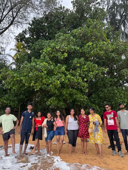 A group photo on the beach, enjoying the sea breeze and the sound of the waves.