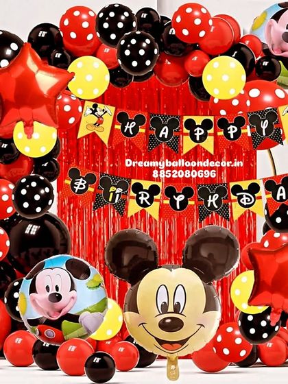 A classic Mickey Mouse themed birthday party. This decoration is packed with red, black, and yellow polka-dot balloons, a character banner, and large Mickey Mouse foil balloons for a timeless look.
