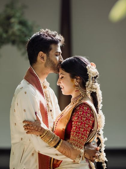 An intimate close-up, with the couple's foreheads touching. The soft light and genuine smiles make this a powerfully romantic and authentic moment.