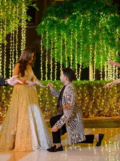 A groom proposes to his bride mid-performance, a surprise moment we helped plan. We love adding personal touches to your sangeet.