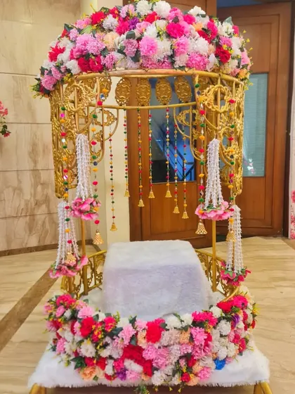This is one of my most popular Doli rentals, decorated with a full arch of pink and white flowers and hanging floral tassels. It's perfect for a fairytale bridal entry.
