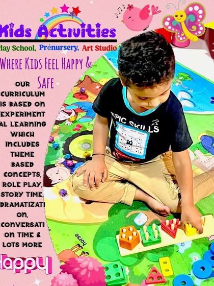 Here, a child is deeply engaged with a shape-sorting toy on a colorful playmat. Our curriculum is based on experimental learning, including theme-based concepts and role-play, to ensure kids feel happy and safe while they learn.