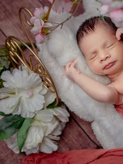 Three weeks old and blooming. This setup combines a floral background with a cute bunny prop for a sweet and whimsical portrait.