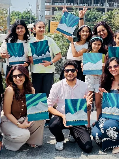 We saw the Northern Lights in broad daylight. A proud group of artists with their magical Aurora paintings.