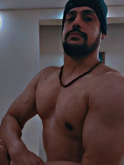 A side-chest pose during a bulk, showing the thickness being built in the chest and shoulders. Each phase of training has a specific purpose in my programs.