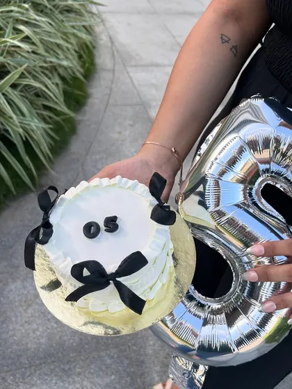 Celebrating 5 years of Colorcoatss. This journey has been a roller coaster, and I'm so grateful for every moment. Holding this cake and balloon feels so surreal.