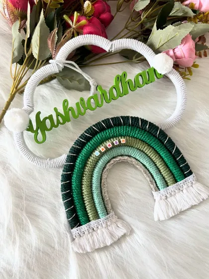 Another beautiful layout of the 'Yashwardhan' name hanging, showcasing its earthy and natural tones.