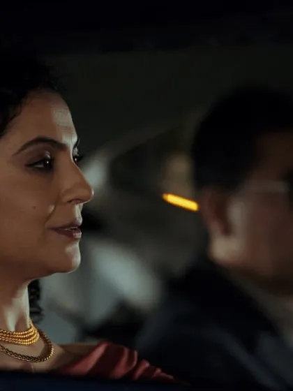 A shot of the couple in the car from the Dezerv ad. I styled them in elegant evening wear, representing people who have their finances figured out.