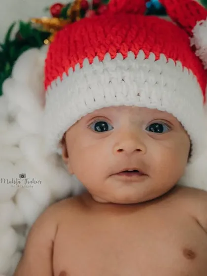 A simple and sweet portrait with a Santa hat is sometimes all you need to capture the Christmas spirit.