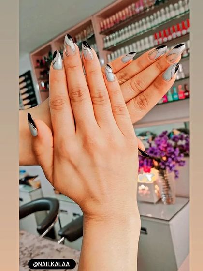 A modern and artistic design with a grey base and abstract black and white swirls.