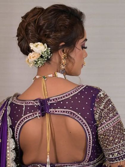 Another angle of the Maharashtrian-inspired updo, showing how the flowers are carefully placed to enhance the overall shape and style.