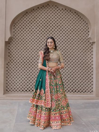 Another full-length shot of the bride, looking happy and radiant.