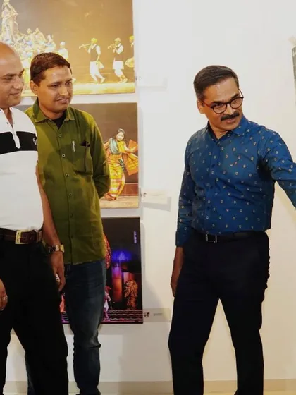 Discussing a photograph with Dr. Ravindra Singhal at his exhibition. His work is a challenging and artistic take on our cultural traditions.