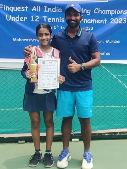 Tuhina Roy receiving her certificate and trophy at the MSLTA Finquest All India U-12 tournament.