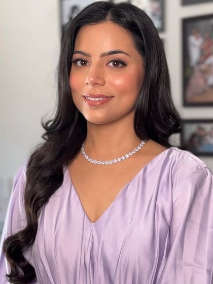 A final portrait in indoor lighting, showing how the makeup photographs beautifully. The skin looks smooth, hydrated, and luminous.