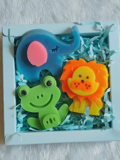 A smaller set of three animal soaps: an elephant, frog, and lion, packed in a cute blue gift box.