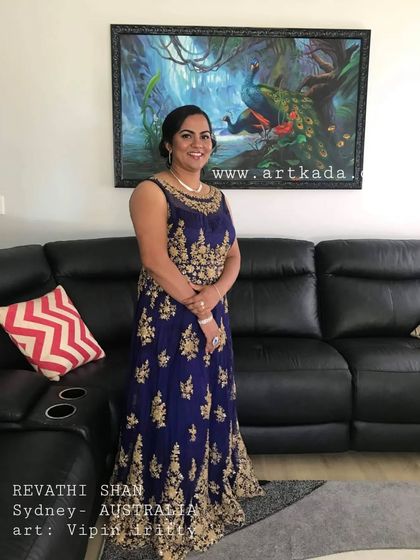 A happy client, Revathi, with her new painting in her home in Sydney, Australia. It's amazing to see my art travel so far.
