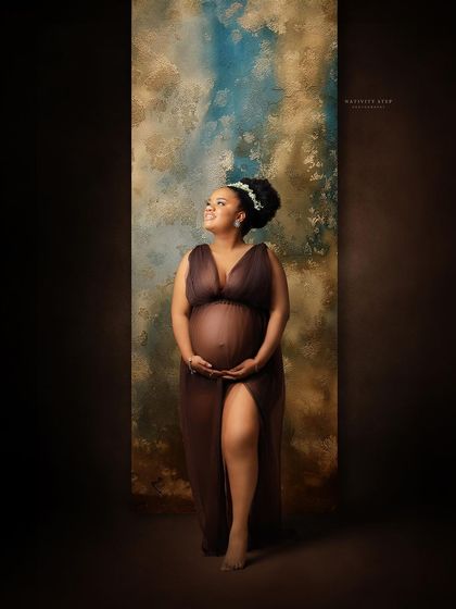 A hopeful and radiant portrait of a mother-to-be. Her upward gaze and the beautiful lighting create a feeling of anticipation and joy.