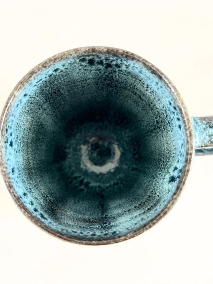 A top-down view into the geometric mug, revealing the beautiful pooling of the turquoise glaze on the inside. I always make sure the inside is as beautiful as the outside.