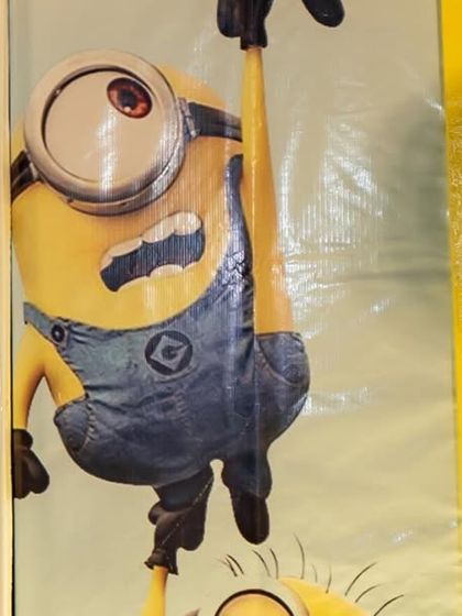 A detail from the Minions backdrop, featuring the mischievous characters and their favorite food, bananas. This playful wallpaper was a key element in creating an immersive and fun environment.