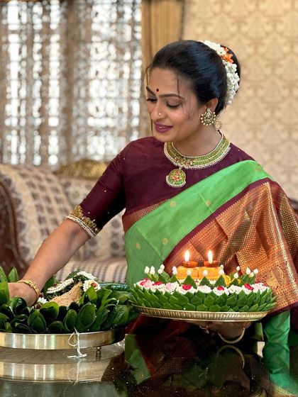 The client's elegant pose and beautiful saree make this a picture of timeless grace.