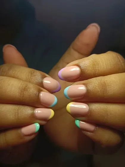 Summer French nails loving. This design features soft pastel tips on short, natural nails for a clean and cute look.