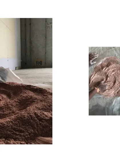 The process of creating custom plaster finishes is entirely hands-on. Here, an artisan mixes and tests the consistency of a new batch, a crucial step in achieving the desired texture and color.