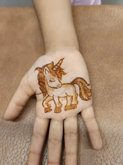 A close-up of the unicorn design. I can create any character or motif that your child loves to make their mehndi experience magical.
