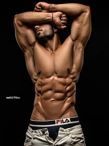 A professional shot showcasing my abdominal definition. This is the kind of result you can expect when you commit to the process.