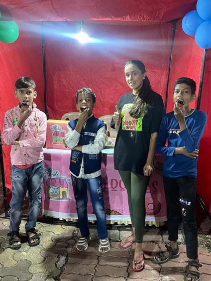 Thumbs up for chocolate donuts. These boys are enjoying the treats they decorated themselves at my pop-up stall.