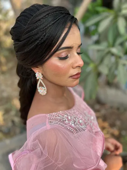 A duplicate of image 162, an outdoor shot showing the intricate hairstyle and the way the makeup looks in a natural setting.