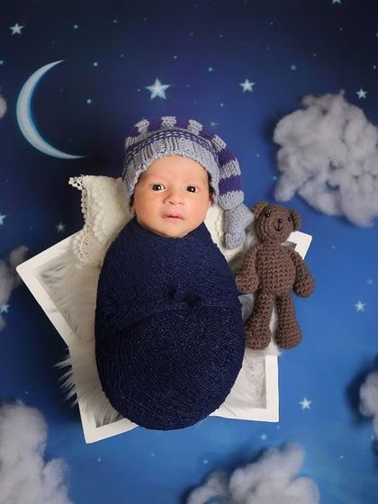 This little one is ready for a lullaby in our starry night scene. The awake moments are just as precious as the sleepy ones.