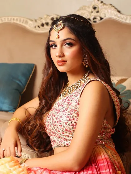 A poised and elegant shot, perfect for showcasing a sophisticated mehendi look.