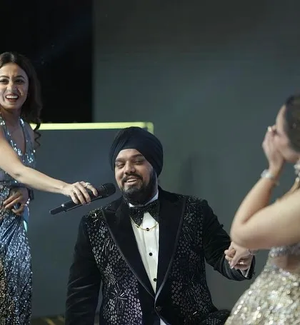 Sharing a laugh with the couple on stage. These happy, unscripted moments are what make a wedding celebration truly special and memorable for everyone.
