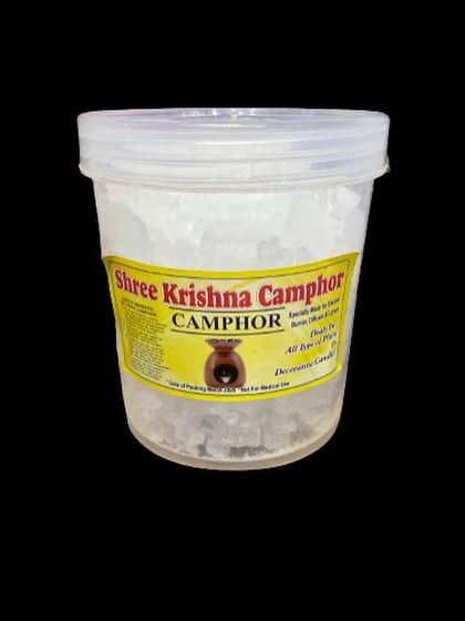 A clear view of our camphor tub with a transparent lid. The label indicates that it is ideal for use in diffusers and for creating a divine atmosphere during prayers or meditation.