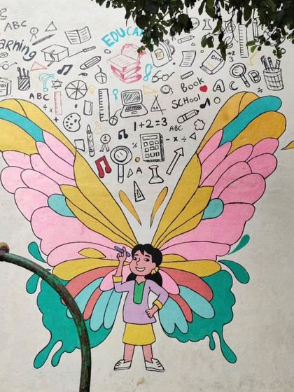 This butterfly girl mural has wings filled with pastel colors and is surrounded by doodles of school supplies and learning symbols.