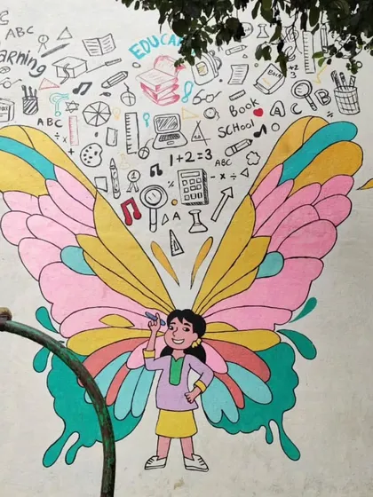 This butterfly girl mural has wings filled with pastel colors and is surrounded by doodles of school supplies and learning symbols.