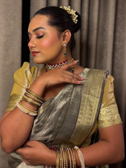 A graceful pose in my traditional saree look. The makeup is kept classic with a winged liner and soft eyeshadow to complement the outfit.