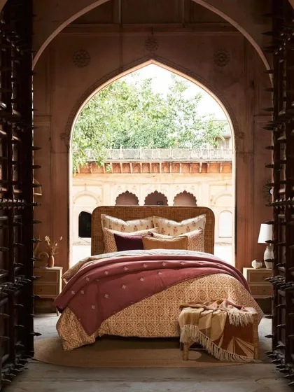 We frame our shots to tell a story. This image for a home decor campaign uses the architecture of a haveli to create a sense of discovery, inviting the viewer into a private, luxurious space.