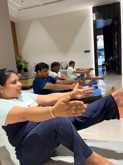 A closer look at the determination and focus during a core-strengthening exercise in a group class.