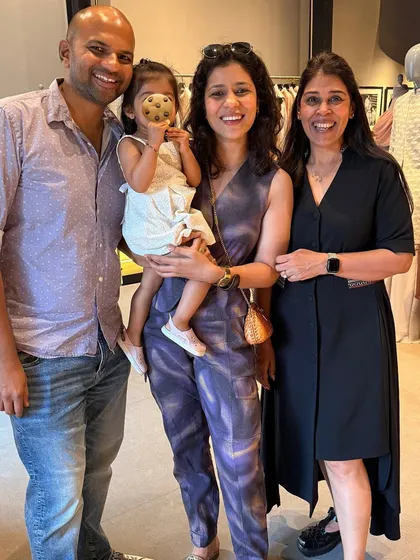 A happy family moment during a designer preview. I love when the whole family gets involved in the fashion journey. Here I am with my husband, daughter, and mother-in-law.