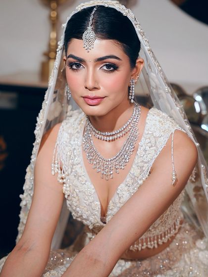 A captivating portrait of the bride. Her makeup is all about fresh, radiant skin and soft touches, making her feel like the best version of herself on her special day.
