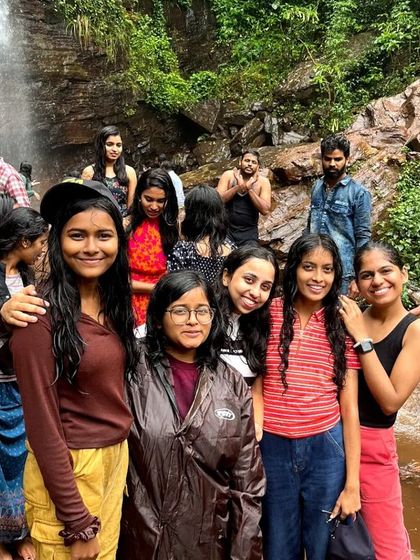 A group of friends enjoying the natural pool at Jhari Falls in Chikmagalur.