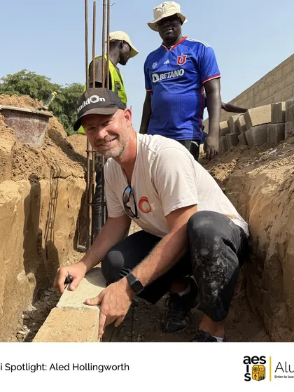 Alumnus Aled Hollingworth on-site at a school construction project. We are proud to see our alumni applying the values of service and community they learned here to make a global impact.