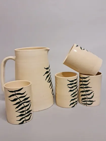 Another view of the fern-motif jug and glasses set. This set is perfect for adding a touch of elegance to your table and is available now at Clay Explore.
