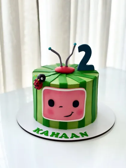 A bright and cheerful Cocomelon cake for a 2nd birthday. I used sharp ganache edges to create the TV shape and added cute fondant details like the ladybug and antennae.