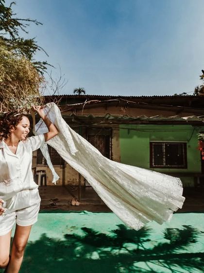 The bride and her dress. A simple, happy moment in the backyard before the day's events begin.